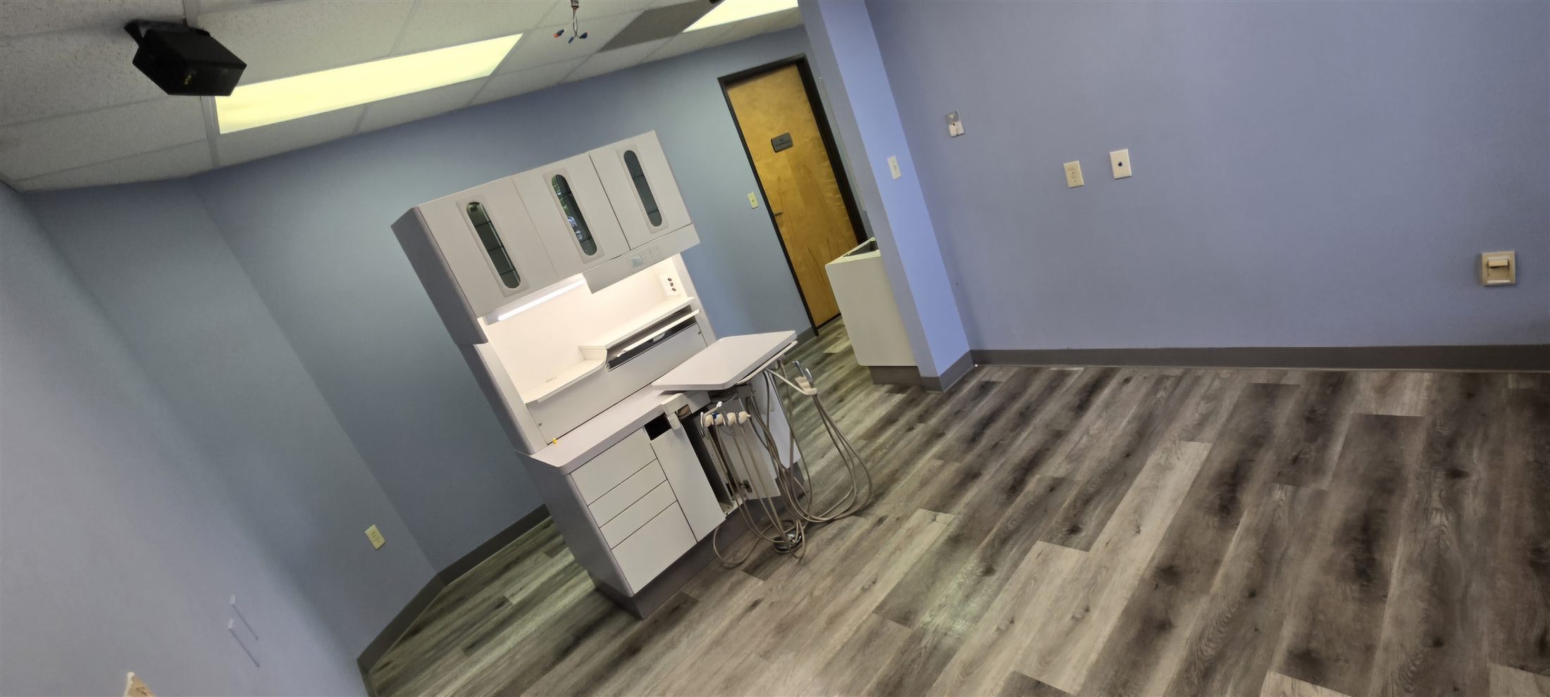 The same operatory after removal: equipment out, floors clean