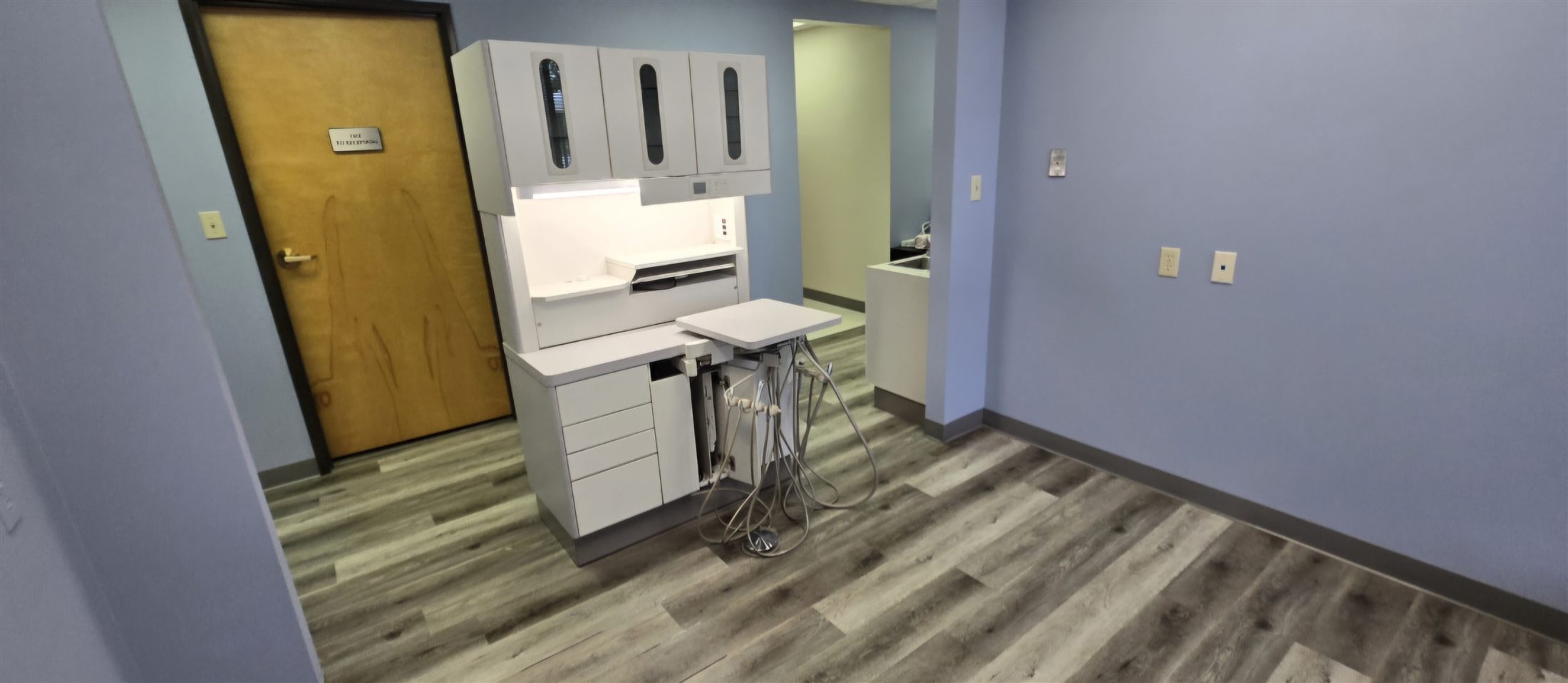 The same operatory after removal: equipment out, floors clean